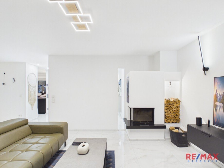 Wohnbereich mit Kamin Bungalow Hannover