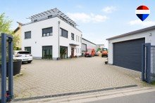 Frontansicht Wohnen und Arbeiten perfekt vereint - Moderne Wohn- und Gewerbeimmobilie mit Halle in Seelze!