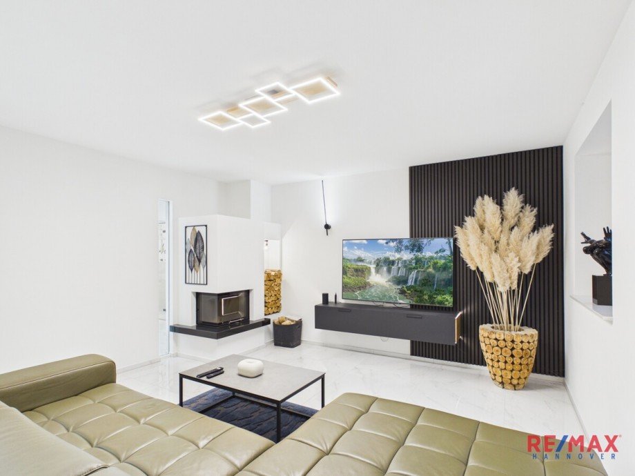 Wohnbereich mit Kamin Bungalow Hannover